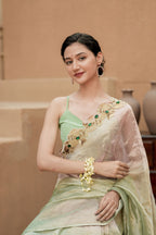 Pure Tissue Blush Gold Saree with Hand-Embroidered Green Stone Border