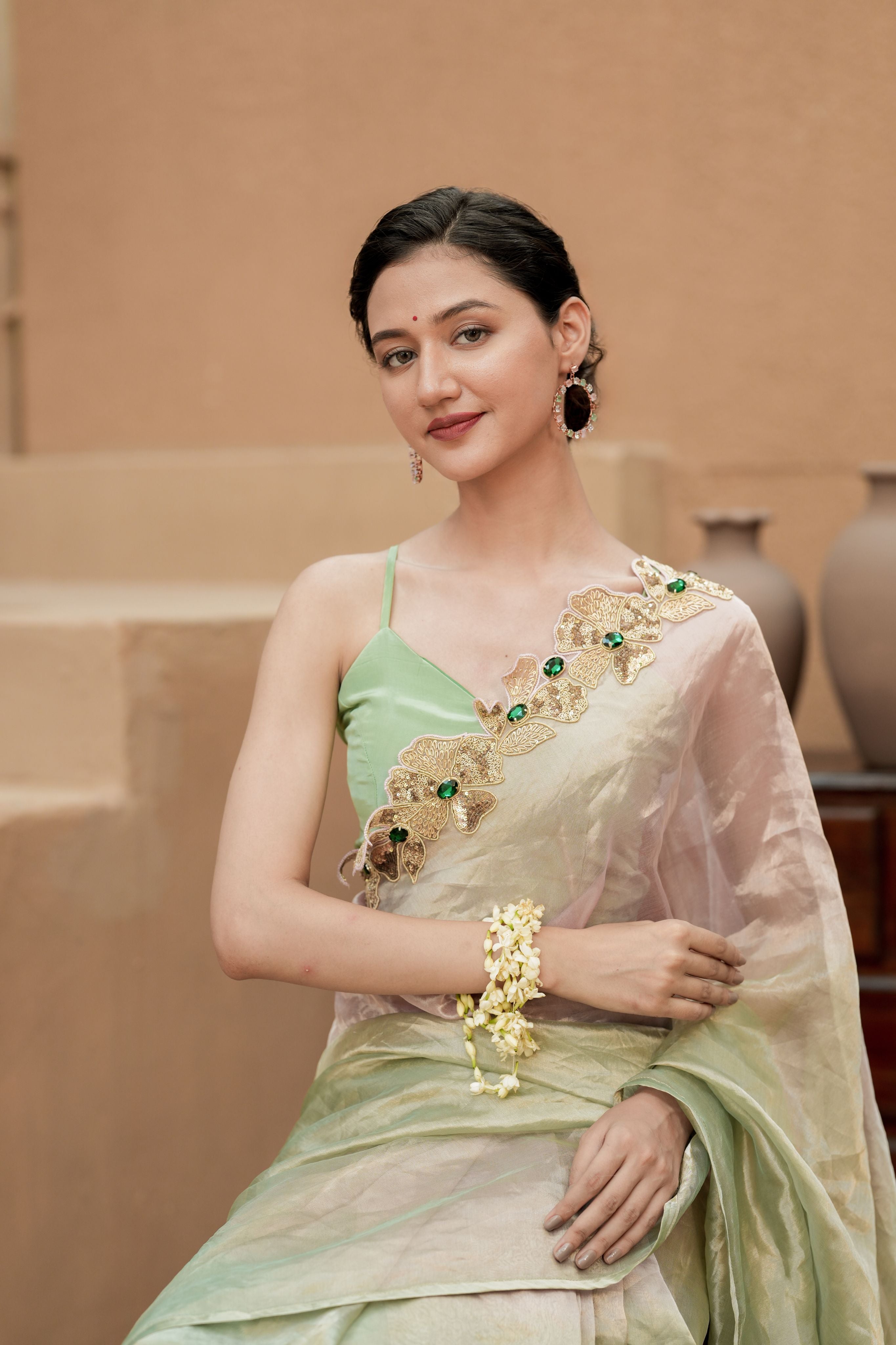 Pure Tissue Blush Gold Saree with Hand-Embroidered Green Stone Border