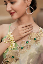 Pure Tissue Blush Gold Saree with Hand-Embroidered Green Stone Border