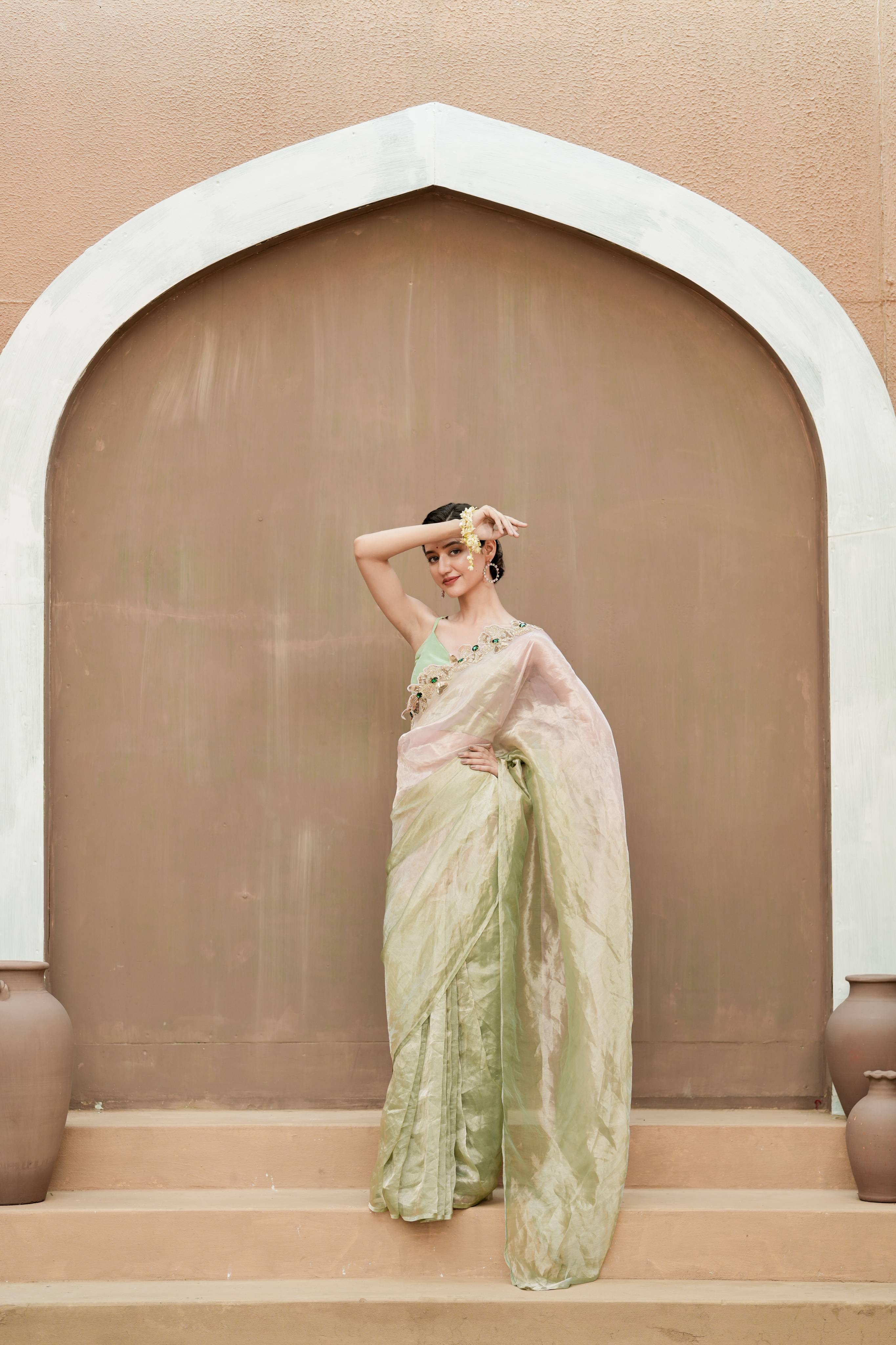 Pure Tissue Blush Gold Saree with Hand-Embroidered Green Stone Border