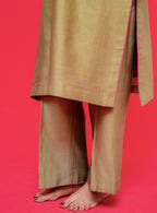 Beige traditional outfit with a pink border on a red background